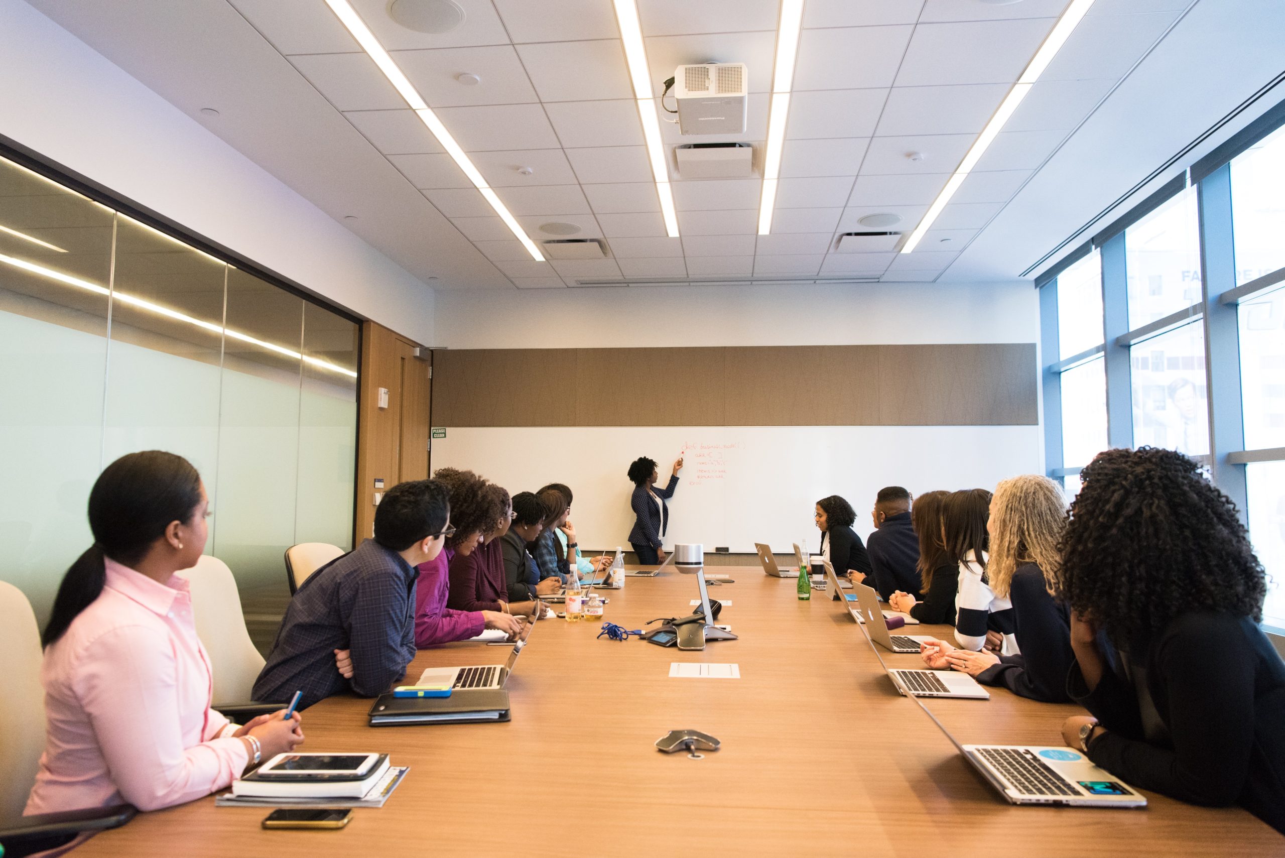 International business coaching, conference room with people in meeting